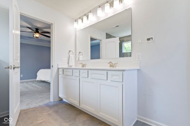 Dual sink vanity is raised for comfort. | Image 34