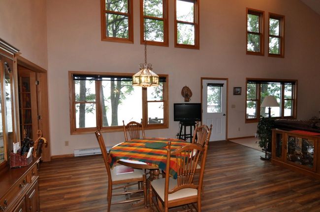 Lakeside door leads out to deck overlooking the yard and lakeshore. | Image 23