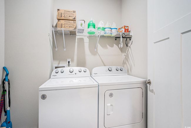 Washroom featuring washer and clothes dryer | Image 23