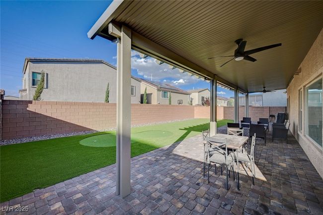 View of Huge Patio with Ceiling Fans and Pavers | Image 46