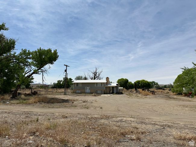 View of yard featuring central air condition unit and a view of rural / pastoral area | Image 11