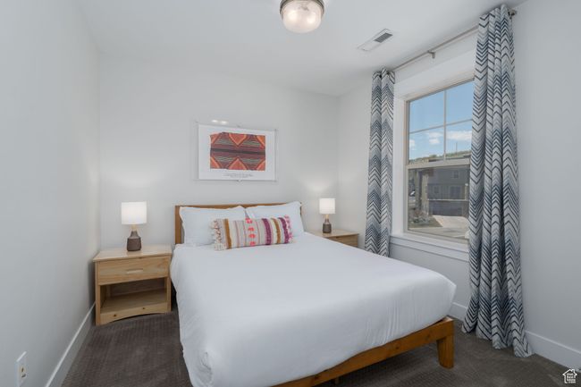 Carpeted bedroom with baseboards | Image 34