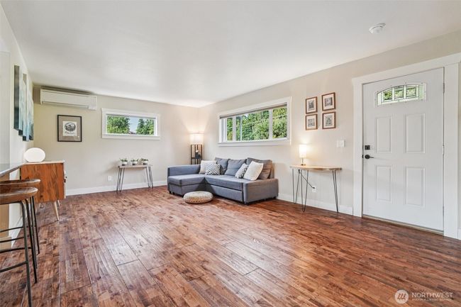 Main living area with kitchen seating. | Image 4
