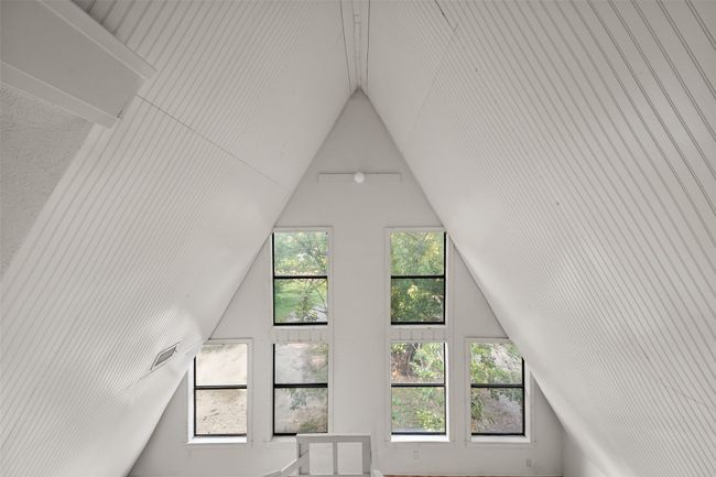Additional living space featuring vaulted ceiling | Image 34