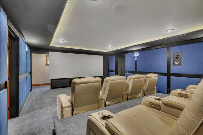 Dedicated theater room with an adjoining sound room, designed for an immersive cinematic experience and optimal audio performance. | Image 74