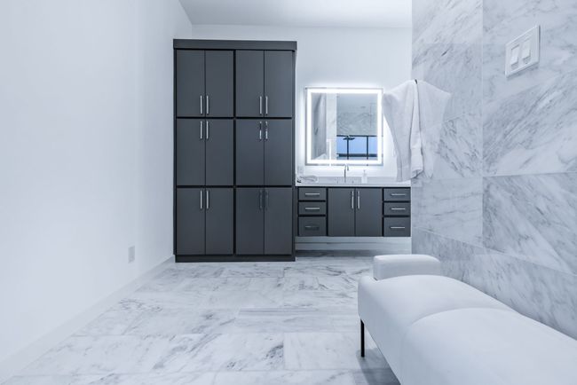 Full bathroom featuring vanity, marble finish flooring, and a tub to relax in | Image 20
