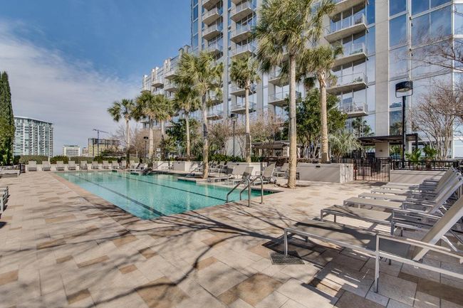 Community pool featuring fence and a patio area | Image 20