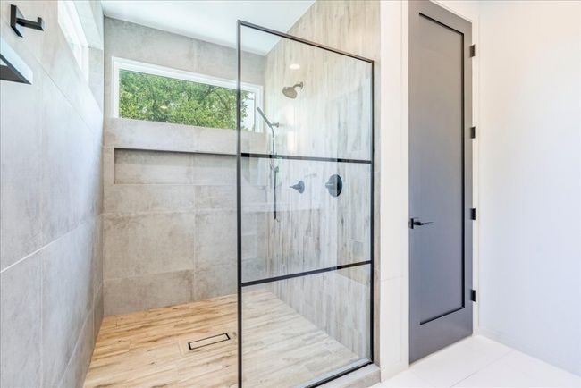 Full bath featuring a shower stall and tile patterned floors | Image 17