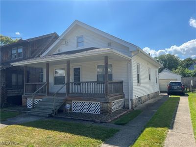 Bungalow-style house with a front yard and a porch | Image 2