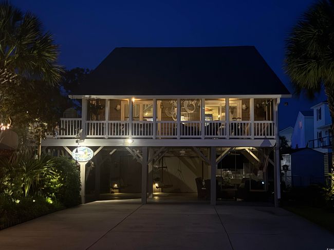 View of front of property with a carport, a sunroom, and driveway | Image 33