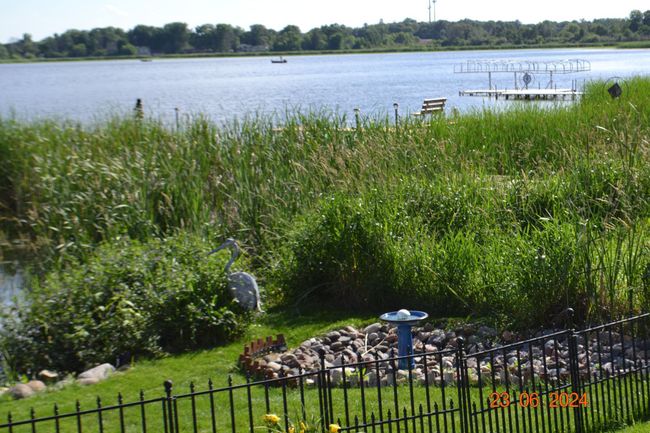 Well maintained garden beds overlooking Ham Lake | Image 48