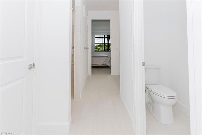 Ensuite bathroom featuring toilet and tile patterned flooring | Image 23