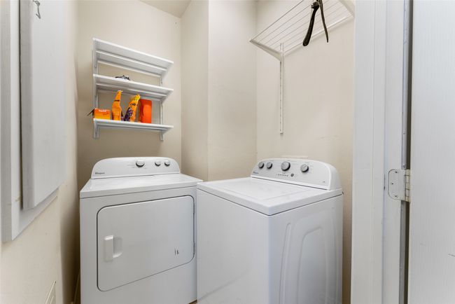 Laundry area with washing machine and clothes dryer and laundry area | Image 24
