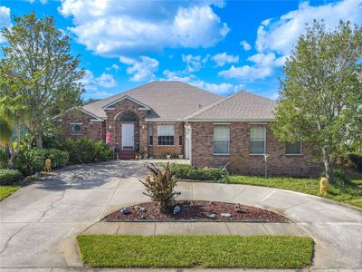 Beautiful, meticulously maintained 4-Bedroom, 2-bath, 2-car garage with Screened in Lanai with Lake View. | Image 1