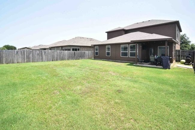 Rear view of house with a patio | Image 30