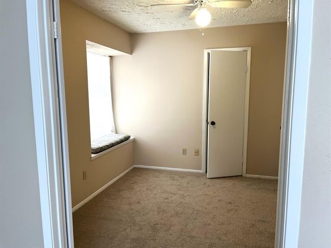 A set of double doors leads to the first bedroom - this room would make a great home office! | Image 5