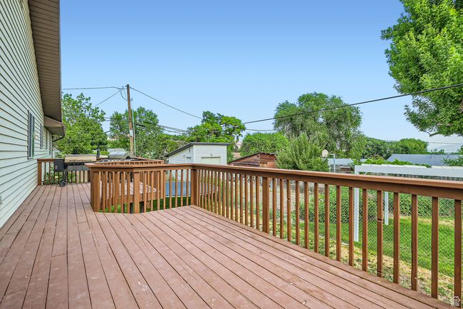 Wooden deck featuring an outdoor structure | Image 28