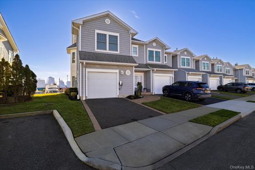 54-54 Ocean Watch Ct, Freeport, NY, 11520-5742 | Card Image