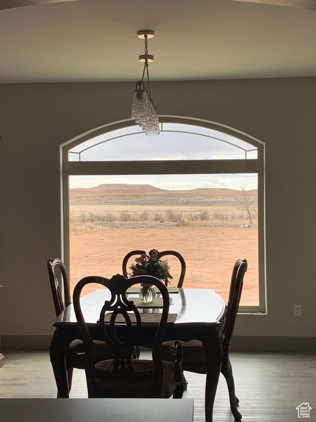 Dining area featuring light wood finished floors and baseboards | Image 6