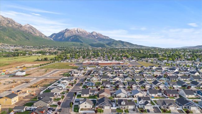 Aerial view of property's location with mountains and nearby suburban area | Image 36