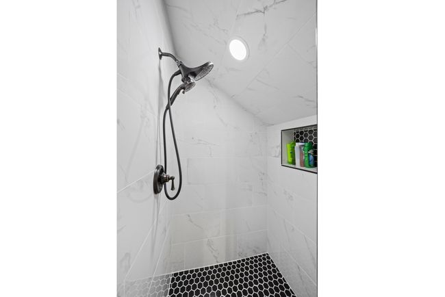 Bathroom featuring a tile shower | Image 55
