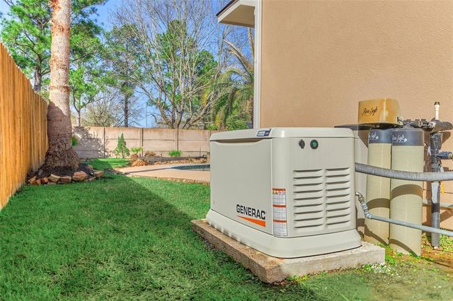 This home features a reliable backup generator and a comprehensive water filtration system for uninterrupted power and clean water. | Image 28