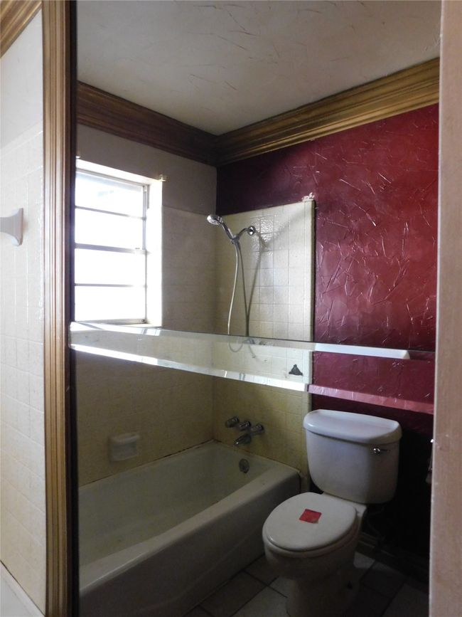 Bathroom featuring tile patterned floors, tiled shower / bath combo, and toilet | Image 12
