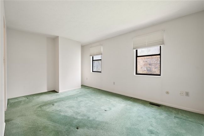 Spacious bedroom with natural light | Image 14