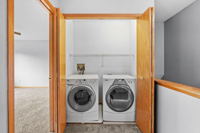 Dedicated laundry space conveniently located on the upper level with washer and dryer included. | Image 17