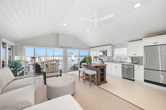 Stunning bay views - you are right on the water! Sit on the deck and watch the manatee go by; TV lowers from its storage box on the wall when you want to watch it instead of the bay | Image 44