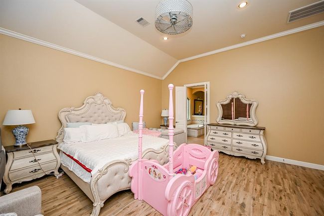 Spacious Primary Bedroom with Crown Molding | Image 22