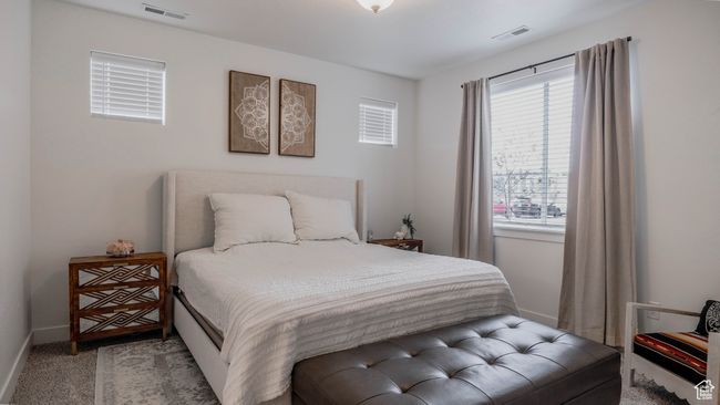 Bedroom with baseboards, visible vents, and carpet | Image 21