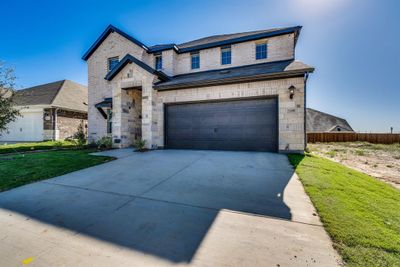 View of front of property featuring a front yard and a garage | Image 2