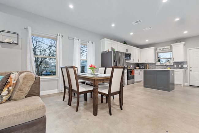Dining space with plenty of natural light and sink | Image 10
