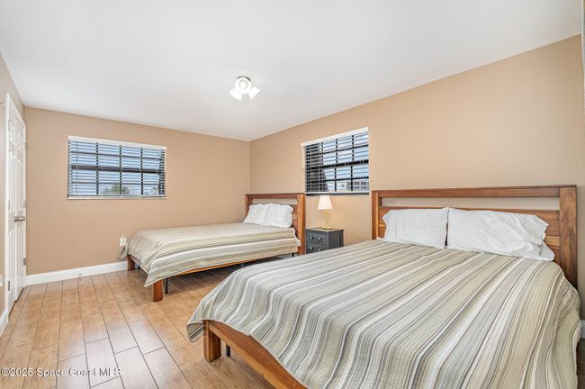 Upstairs West Bedroom with View of Ocean and Pier | Image 30