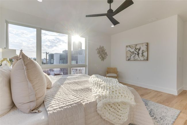 Bedroom featuring ceiling fan and light hardwood / wood-style flooring | Image 24