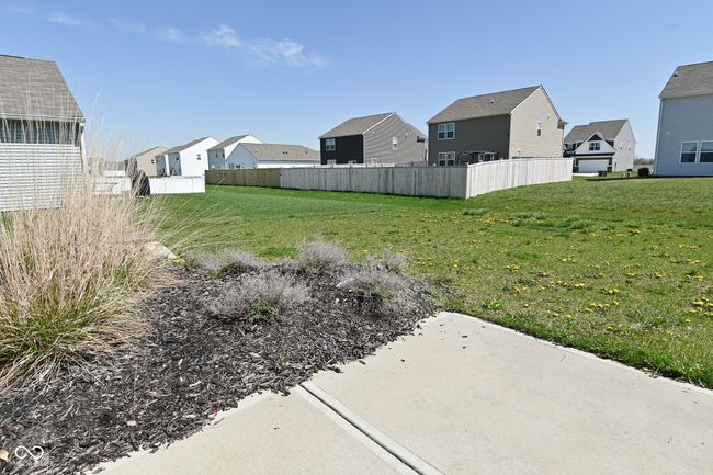 view of yard featuring fence and a residential view | Image 49