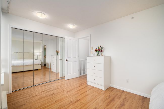 Bedroom featuring light wood-type flooring and baseboards | Image 13