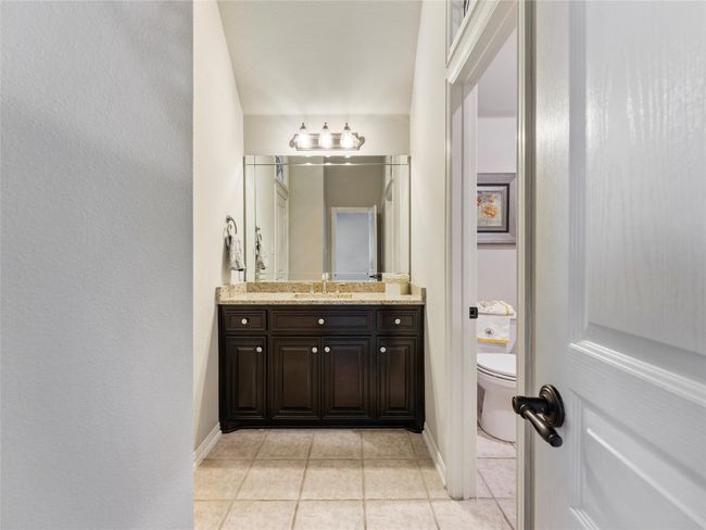 Bathroom with tile patterned floors and vanity | Image 29