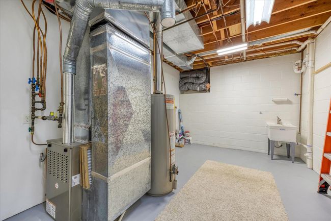 One of the cleanest mechanical/storage rooms you'll find! Plenty of space for storage and hobbies! | Image 44