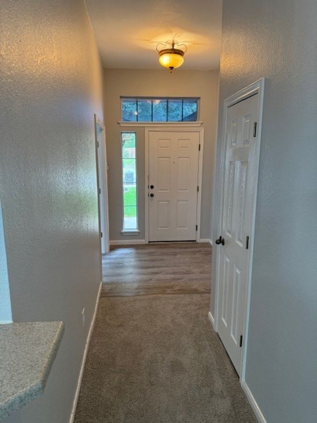 Carpeted entryway featuring baseboards | Image 6