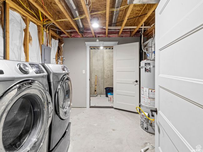 Washroom with secured water heater, washing machine and clothes dryer, and electric panel | Image 16