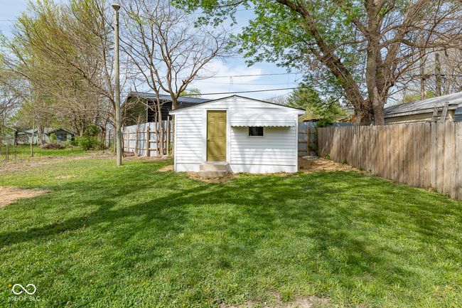 view of outbuilding with fence | Image 28