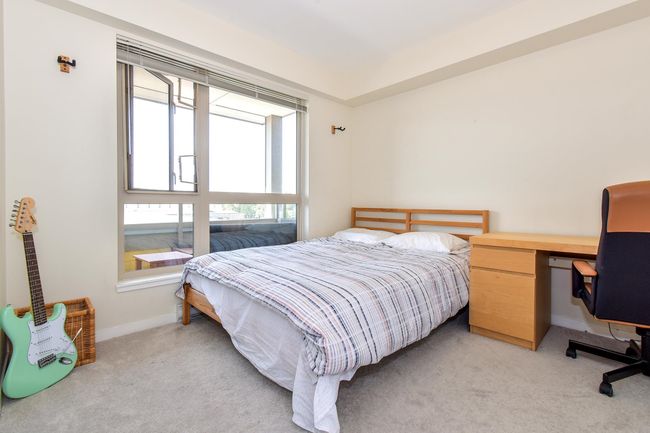 Bedroom with light colored carpet | Image 8