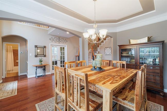 Another view of the formal dining looking towards the entry and study. | Image 12