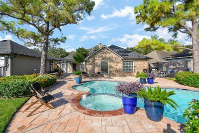 Gorgeous backyard oasis complete with pool and spa. | Image 2