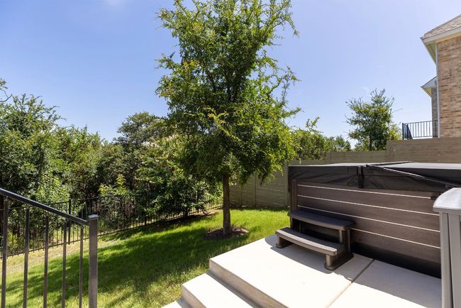 a hot tub plus plenty of backyard space | Image 32