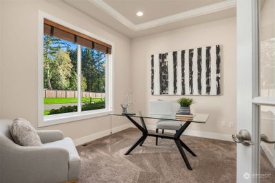 French doors open to a den/office just off the foyer. | Image 3