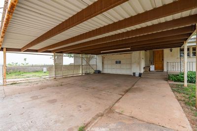 View of patio featuring a carport | Image 3