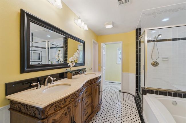 Bathroom featuring a shower stall, double vanity, a garden tub, and tile patterned floors | Image 21